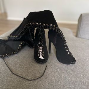 Black heeled tie up boots